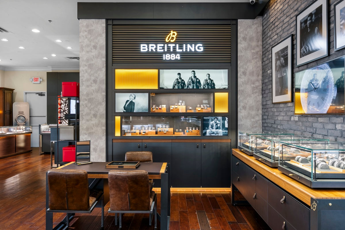 Breitling Brand Zone at Markham Fine Jewelers Frisco interior with display cases and branded wall.