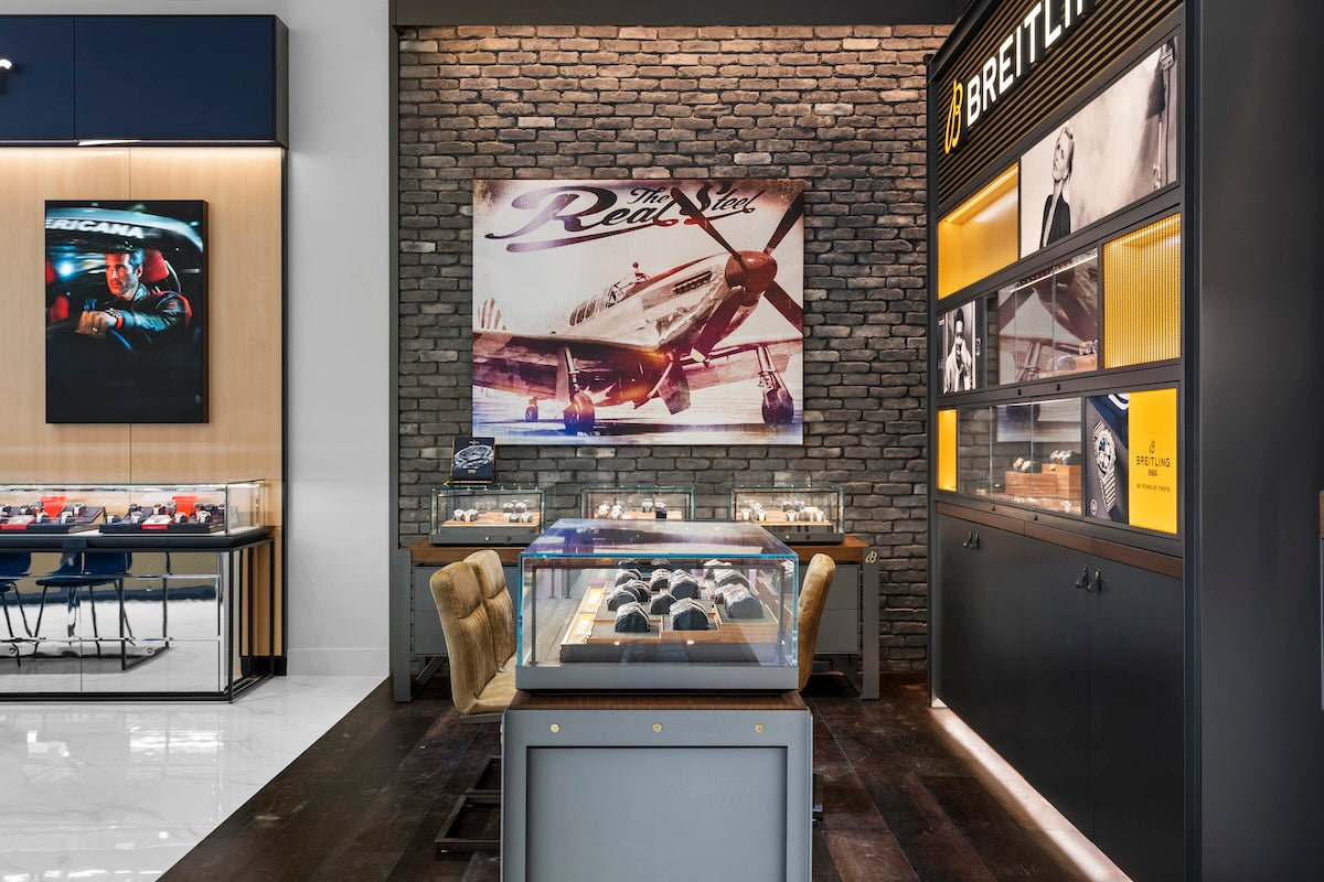 Breitling Brand Zone in Southlake Texas at Markham Fine Jewelers with a display case with watches and Breitling branding.