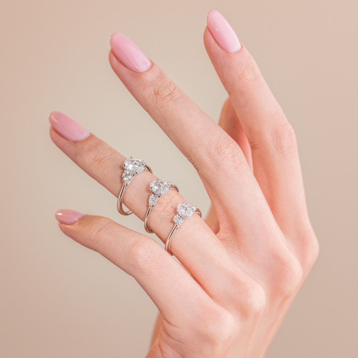 Three Stone Round Side Stone Diamond Engagement Ring